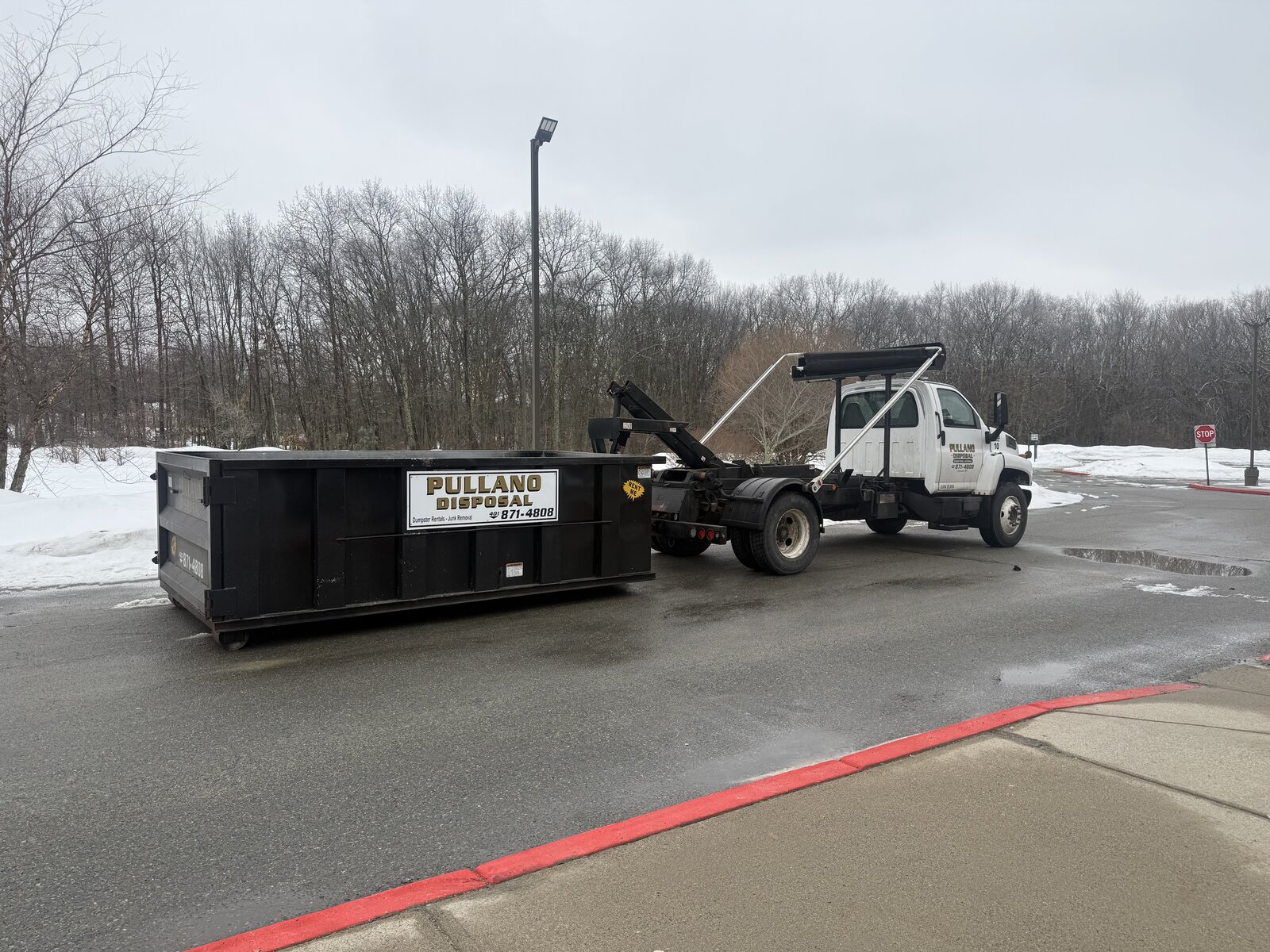 Pullano Disposal truck loading dumpster
