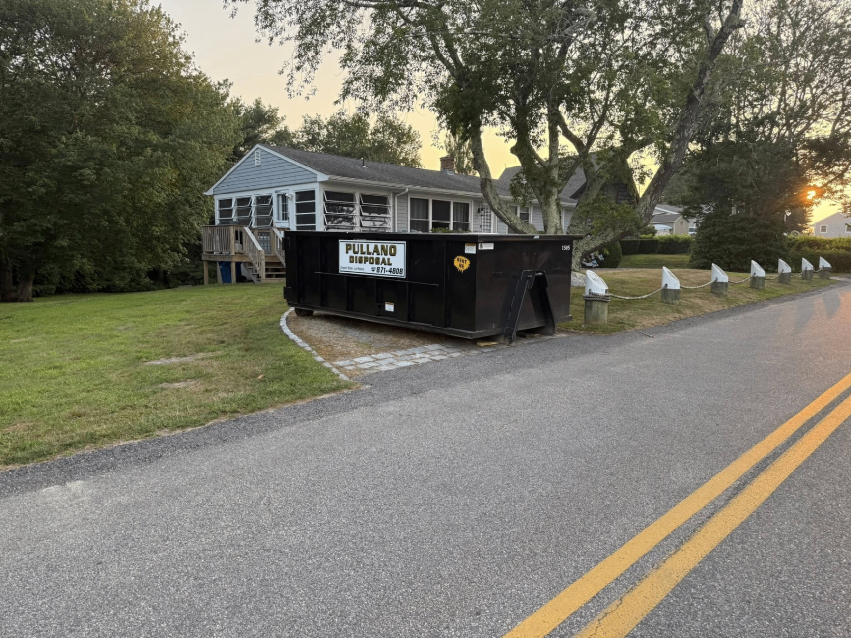 Pullano Disposal dumpster rental on a residential street